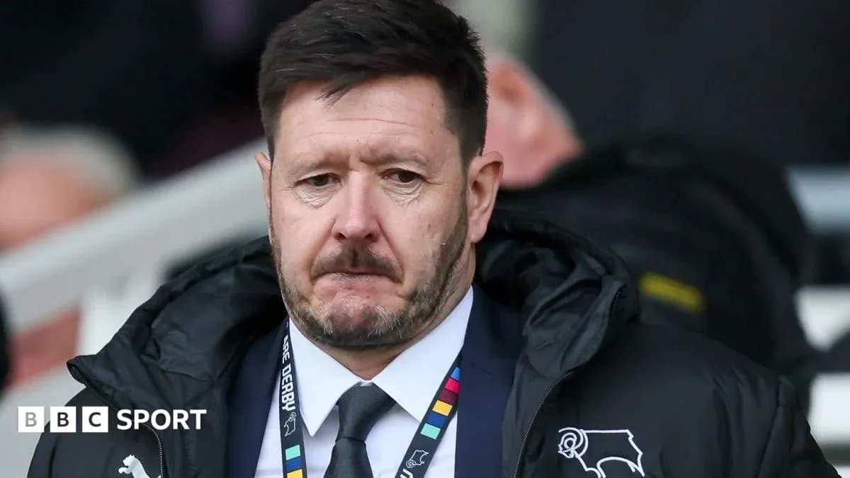 Manager in a coat on the sidelines during match Manager in a coat on the sidelines during match