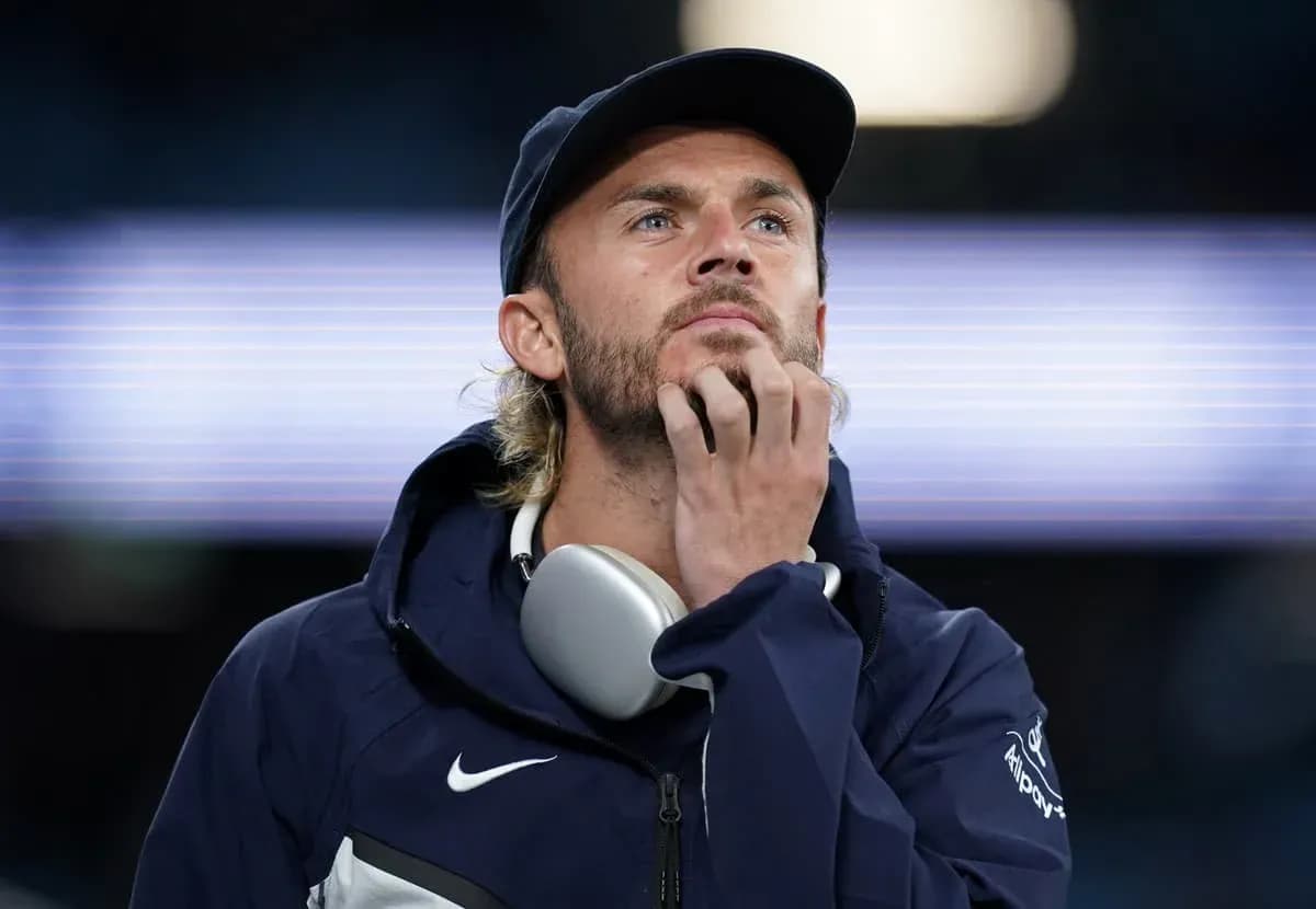 Man in hoodie and cap looking thoughtfully Man in hoodie and cap looking thoughtfully