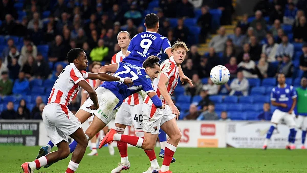 Player jumping to head the ball during match Player jumping to head the ball during match