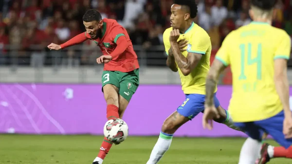 Moroccan player kicking the ball against Brazil Moroccan player kicking the ball against Brazil