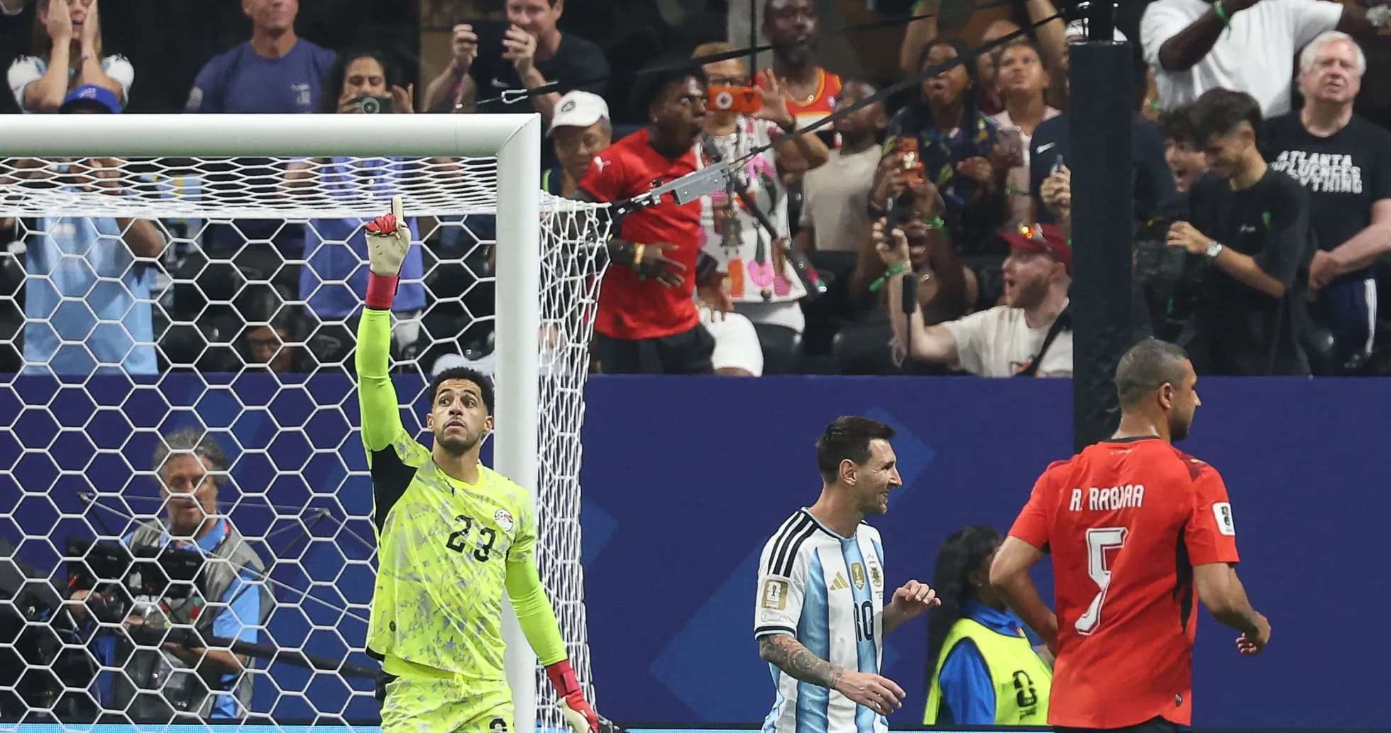 Goalkeeper celebrating a save during match action Goalkeeper celebrating a save during match action