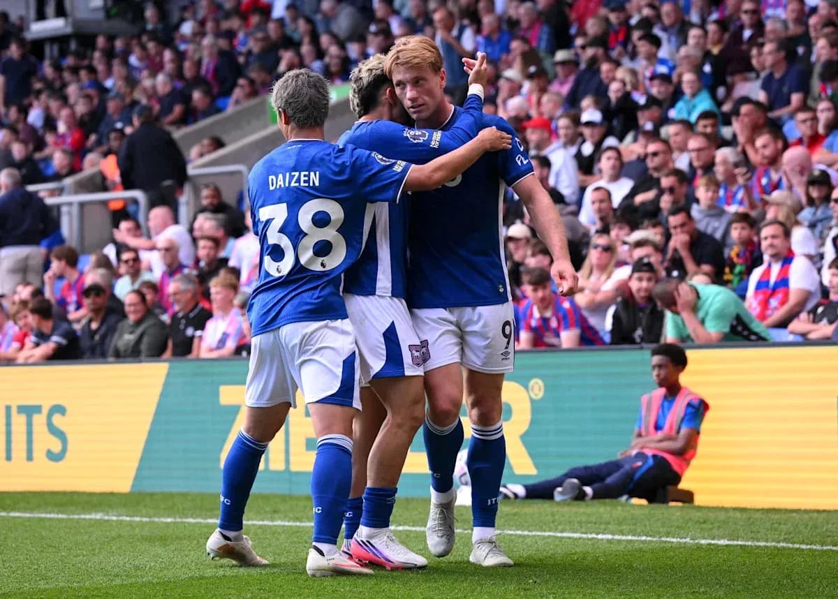 Players celebrating a goal during a match Players celebrating a goal during a match
