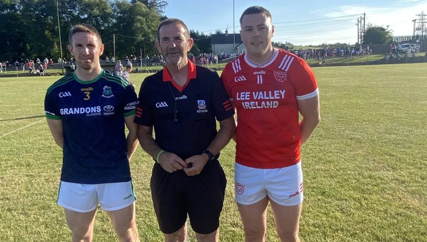 Two players and a referee before a match Two players and a referee before a match