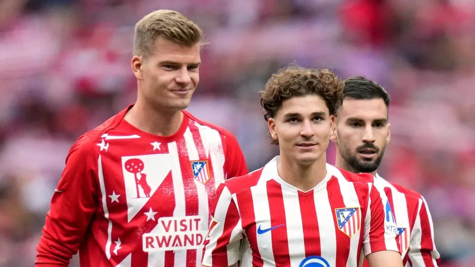 Atletico Madrid players in red and white jerseys Atletico Madrid players in red and white jerseys
