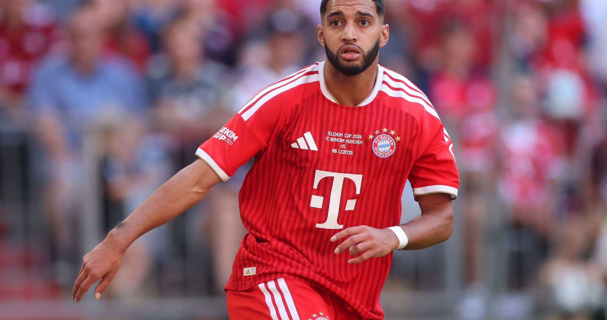 Player running during Bayern Munich match in red kit Player running during Bayern Munich match in red kit
