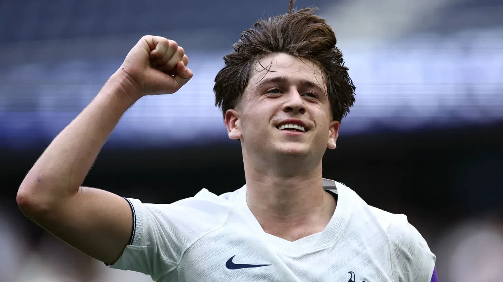 Player celebrating with raised fist after scoring Player celebrating with raised fist after scoring