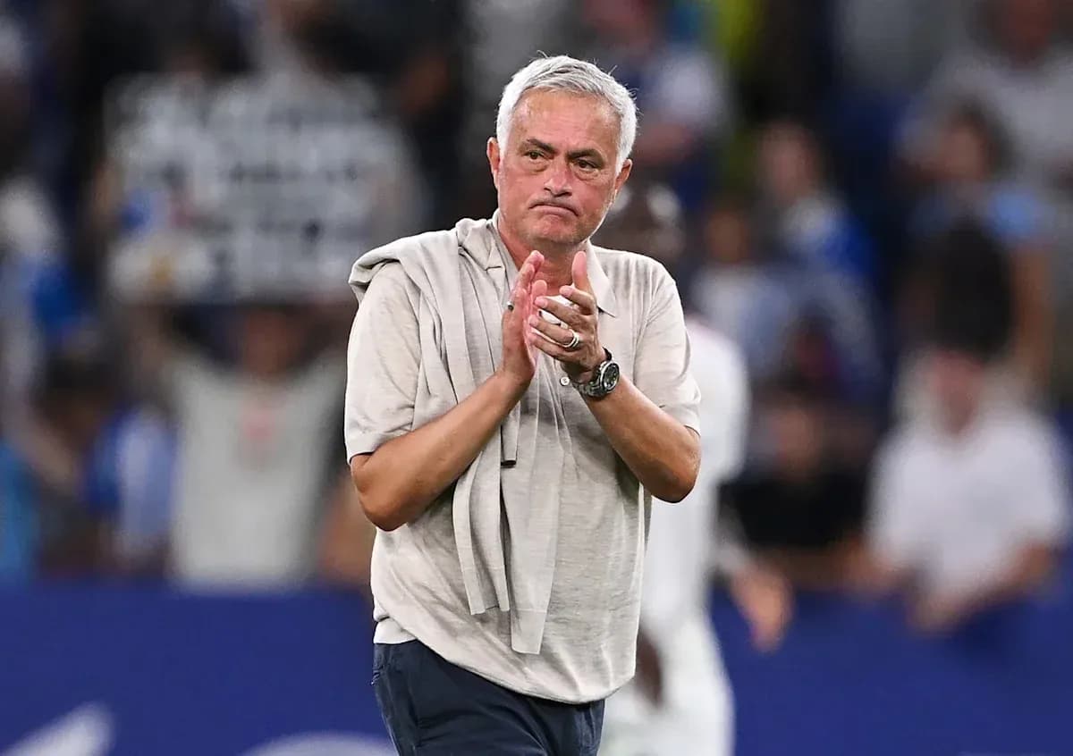 Coach applauding fans after match in stadium Coach applauding fans after match in stadium
