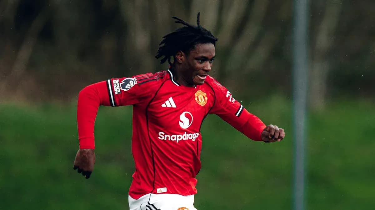 Player running on the field in Manchester United jersey Player running on the field in Manchester United jersey