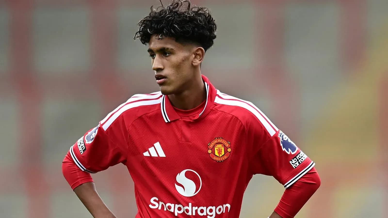 Young player in Manchester United jersey during match Young player in Manchester United jersey during match