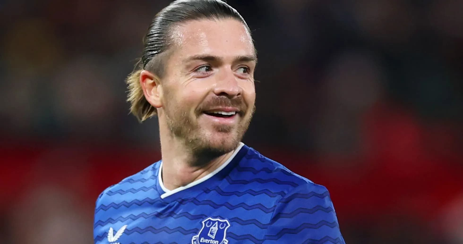 Everton player smiling during a match Everton player smiling during a match