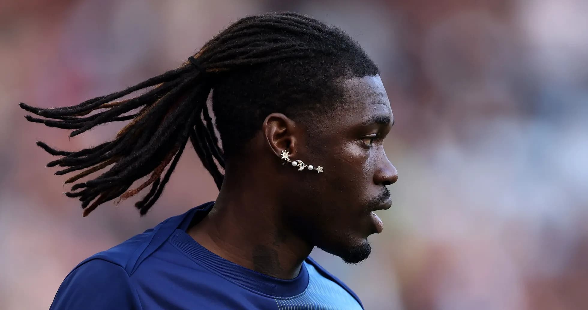 Player with long hair during warm-up session Player with long hair during warm-up session