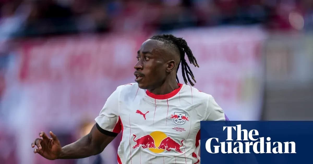 Player running during a match wearing RB Leipzig jersey Player running during a match wearing RB Leipzig jersey