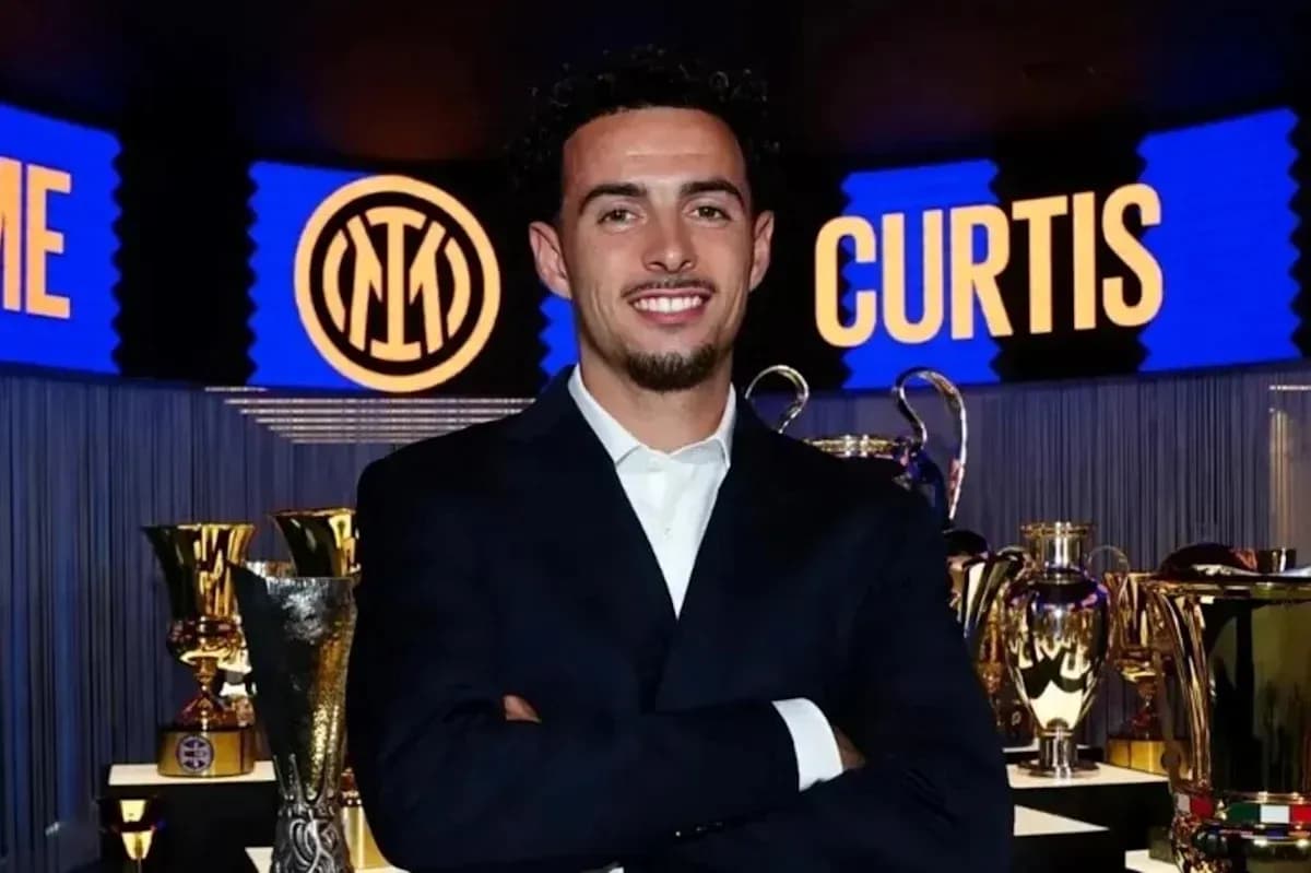 Man smiling in front of trophy display Man smiling in front of trophy display