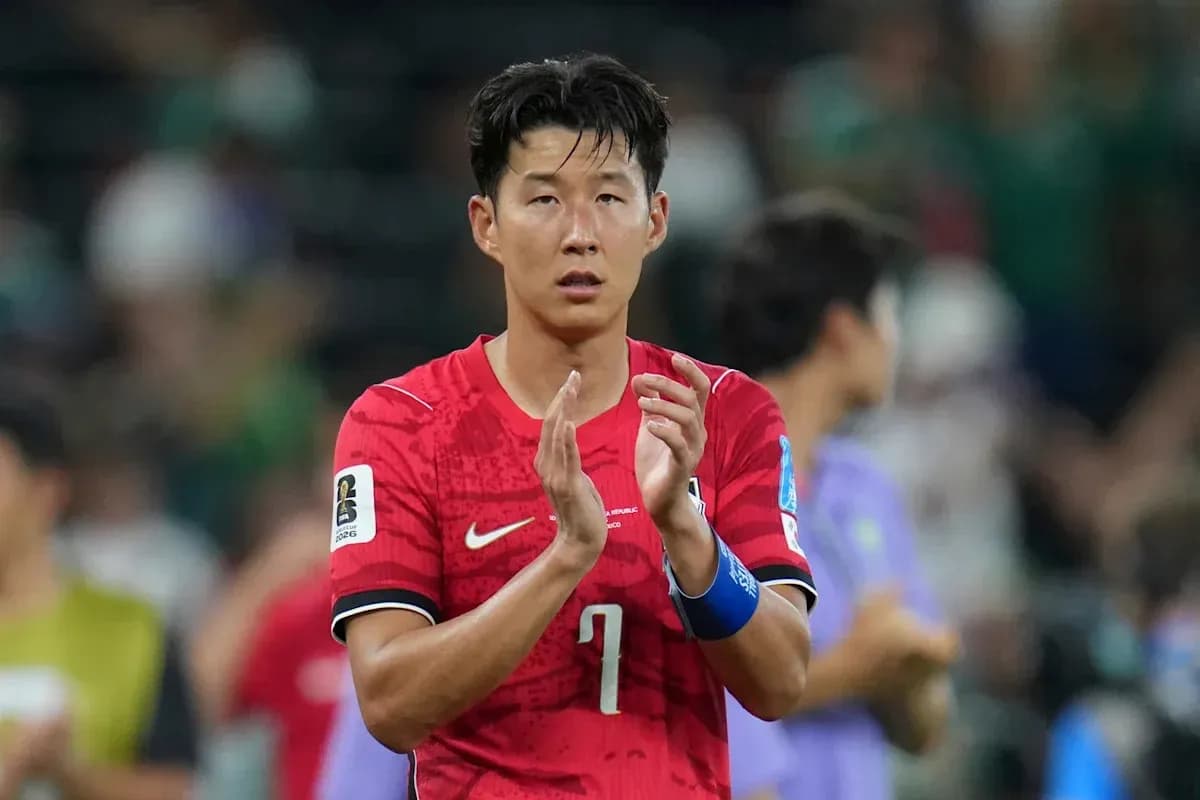 Player applauding after match in red jersey Player applauding after match in red jersey