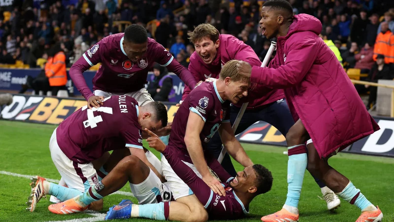 Burnley players celebrating a goal during match Burnley players celebrating a goal during match