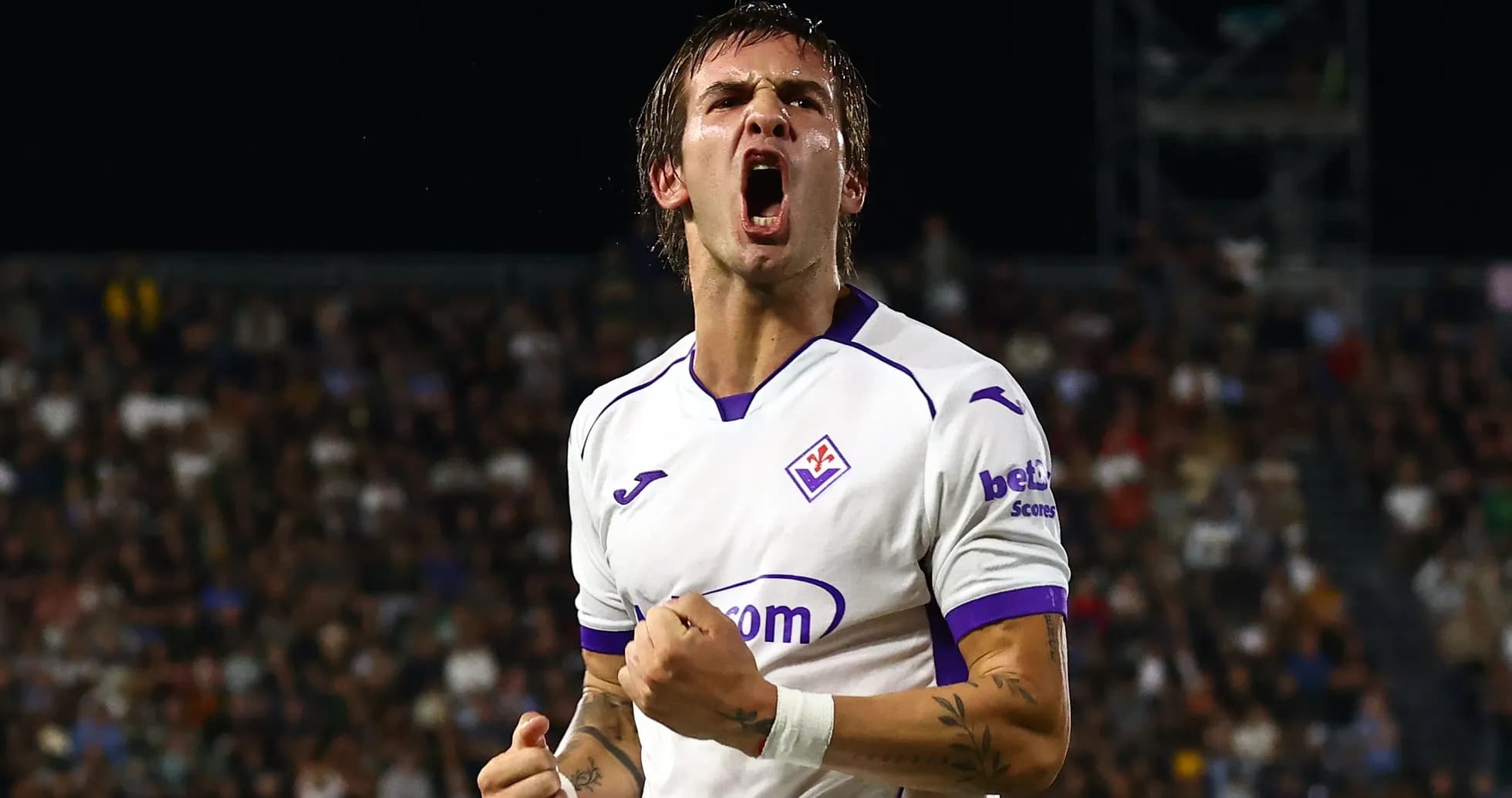 Fiorentina player celebrating a goal passionately Fiorentina player celebrating a goal passionately