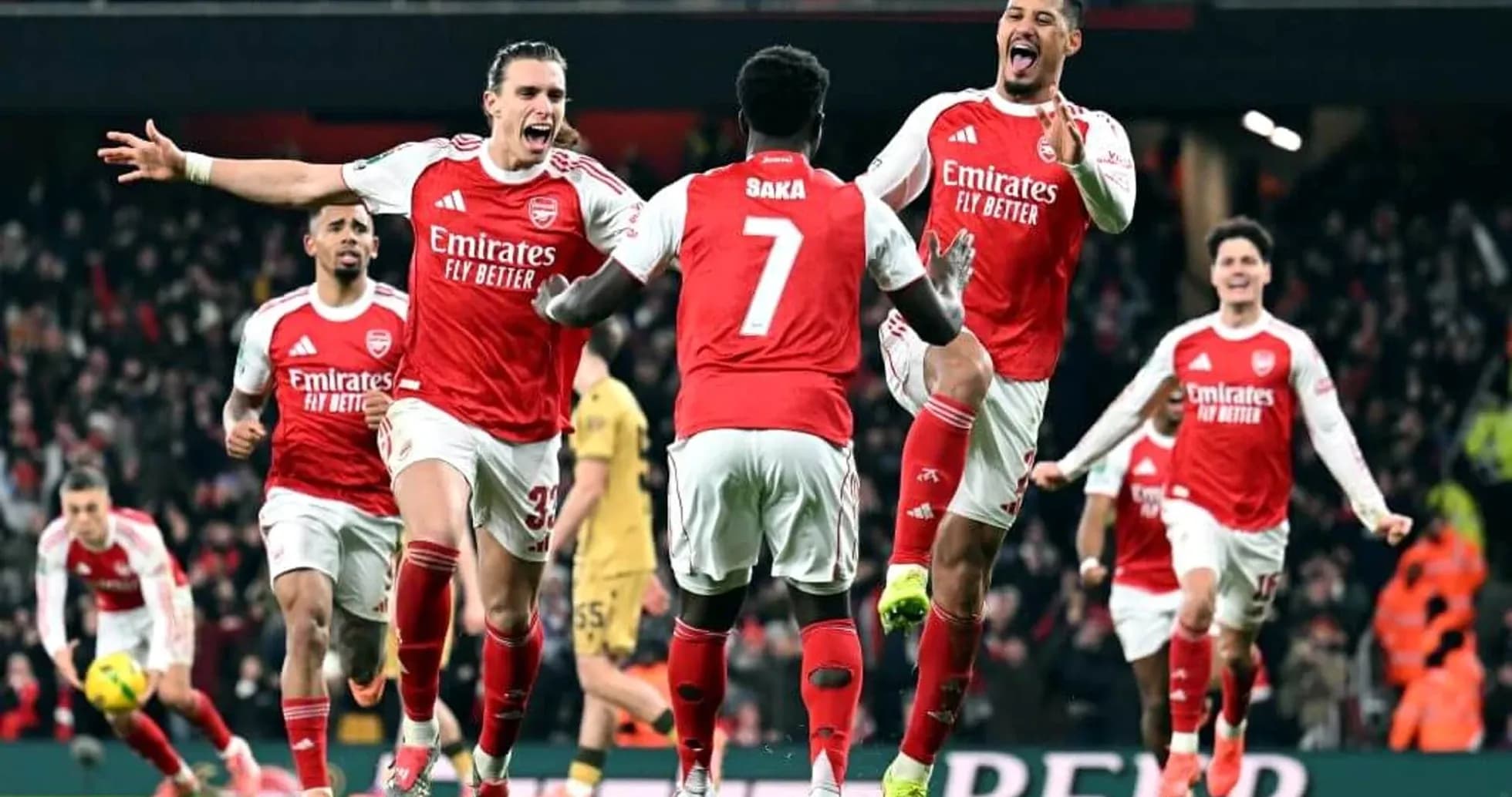 Arsenal players celebrating a goal during match Arsenal players celebrating a goal during match