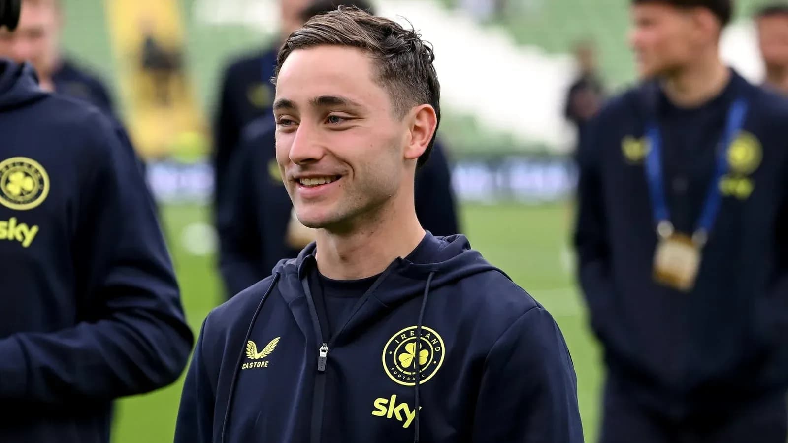 Player smiling in team training gear before match Player smiling in team training gear before match