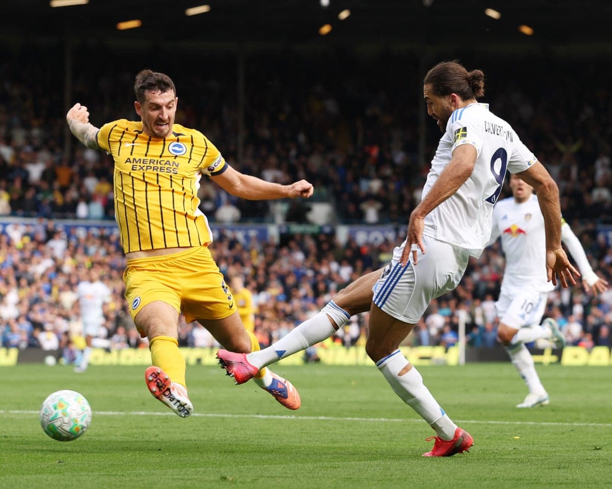Leeds and Brighton players competing for the ball Leeds and Brighton players competing for the ball