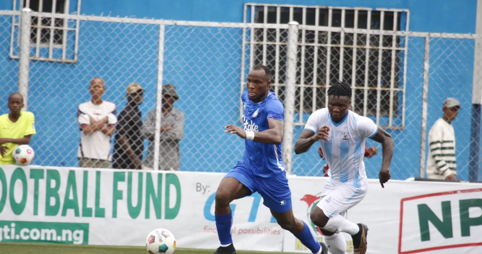 Players competing for the ball during NPFL match Players competing for the ball during NPFL match