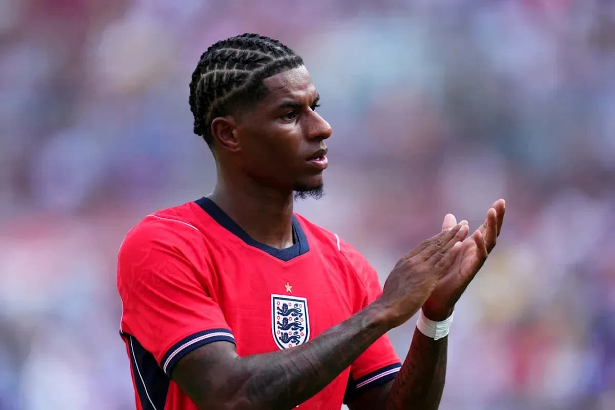 Player applauding during match wearing red England jersey Player applauding during match wearing red England jersey