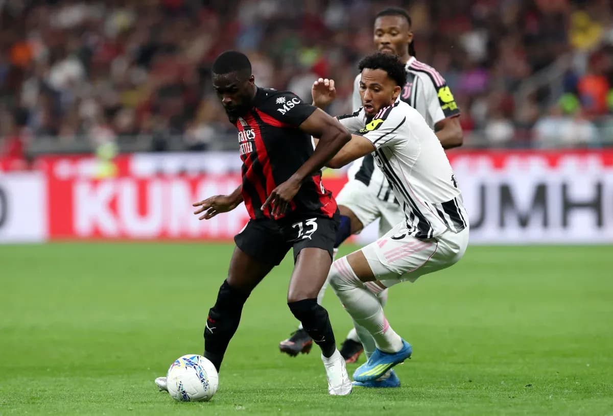 Player tackling opponent during Juventus vs AC Milan match Player tackling opponent during Juventus vs AC Milan match