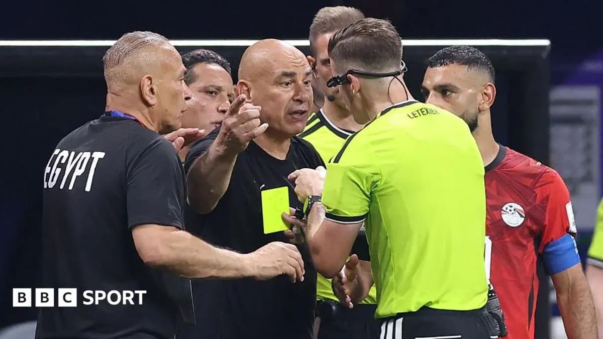 Coach discussing with referee during a match Coach discussing with referee during a match