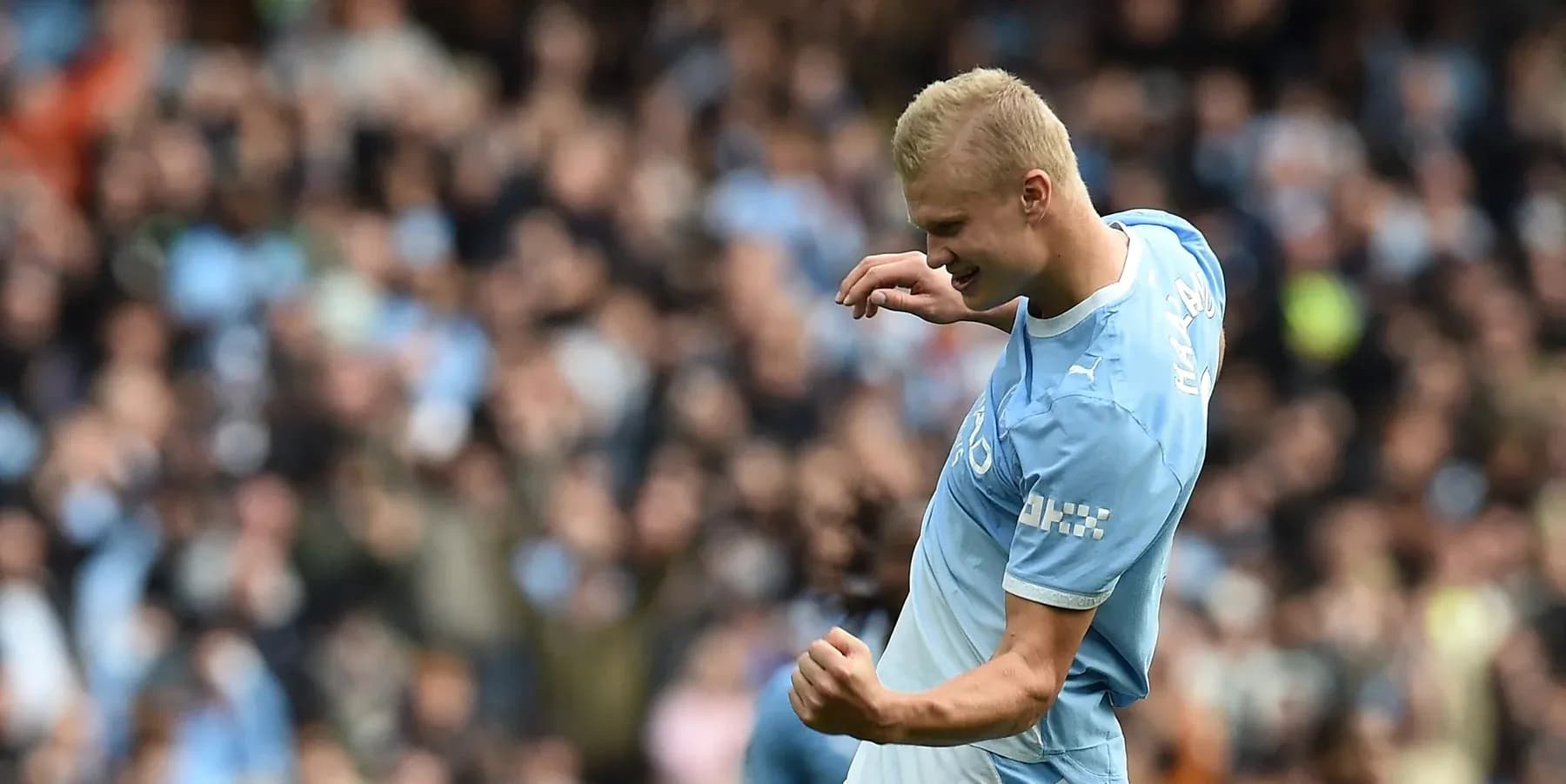 Player celebrating a goal during a match Player celebrating a goal during a match