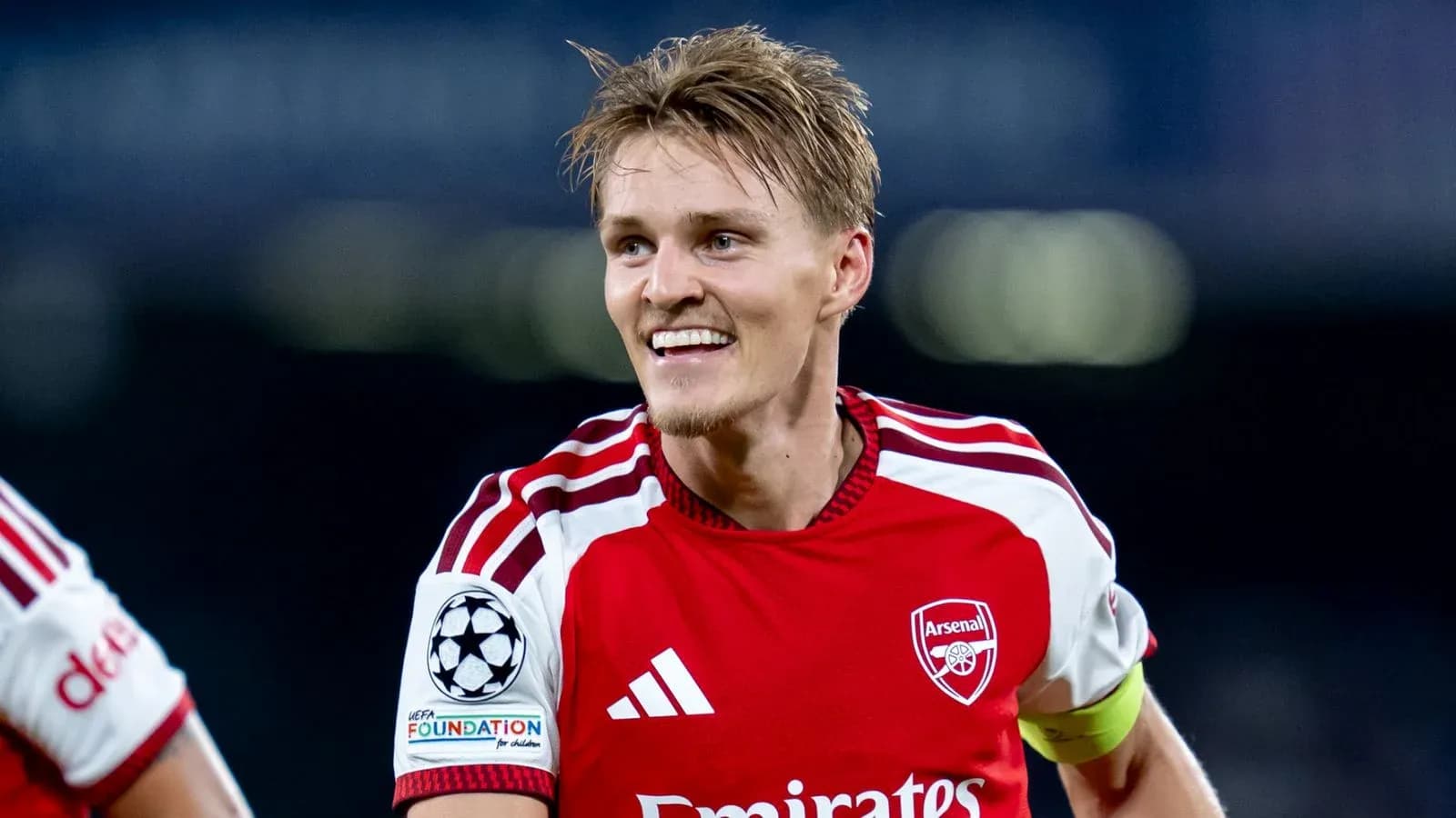 Player celebrating in Arsenal kit during match Player celebrating in Arsenal kit during match