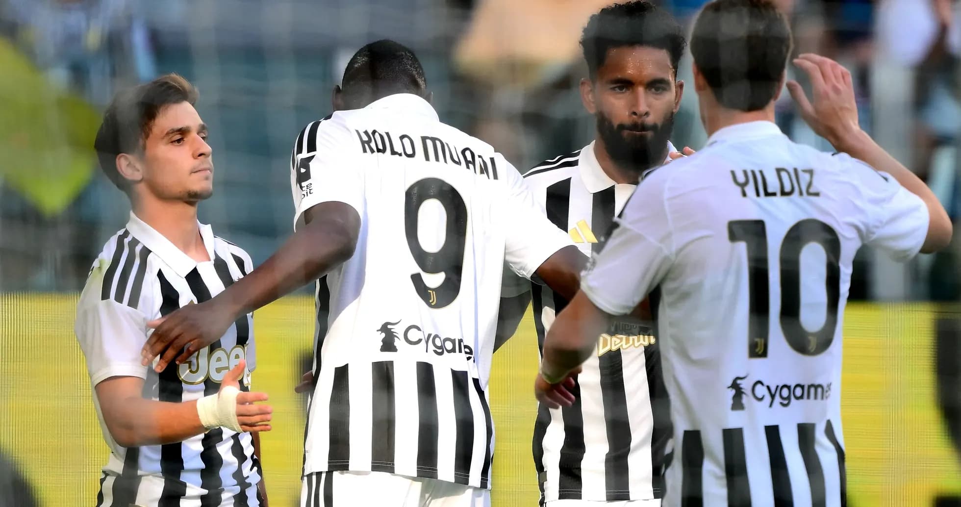 Juventus players celebrating a goal on the pitch Juventus players celebrating a goal on the pitch