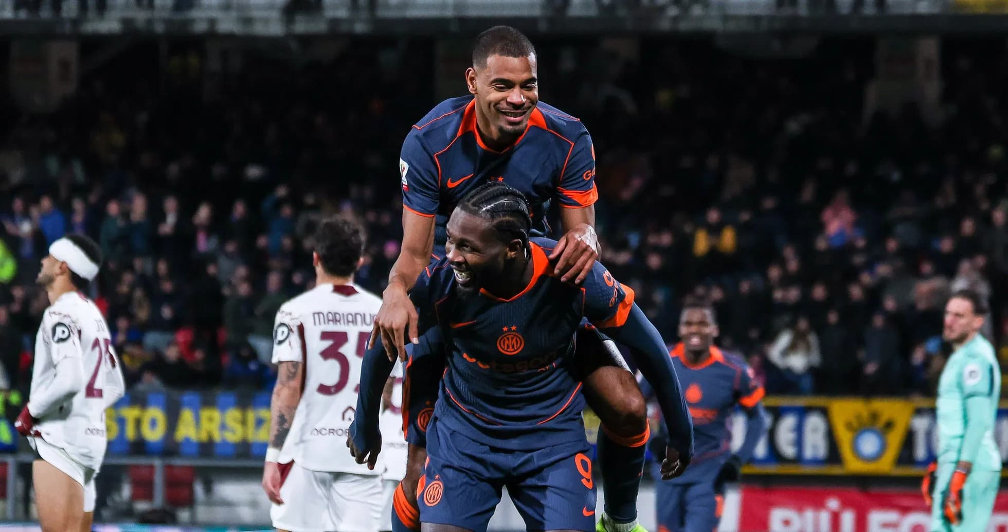 Players celebrating after scoring a goal during match Players celebrating after scoring a goal during match