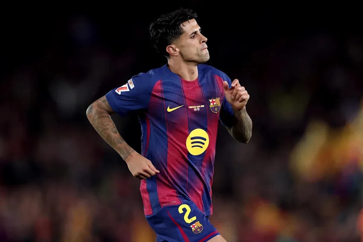Player in Barcelona kit running on the field Player in Barcelona kit running on the field
