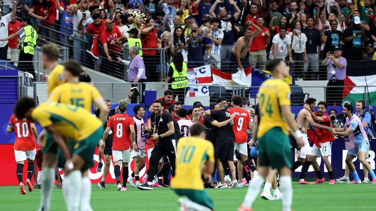 Players celebrating a victory with fans in stadium Players celebrating a victory with fans in stadium