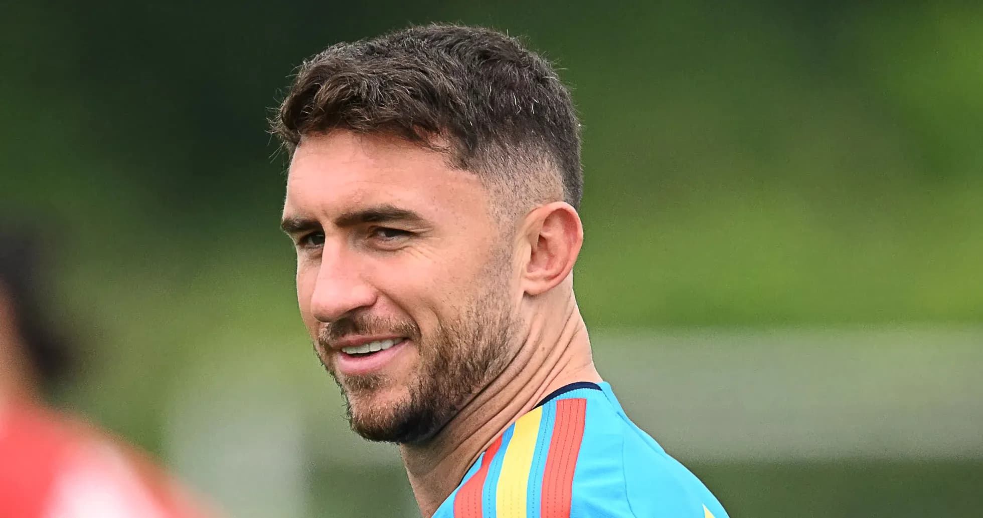 Player in training gear smiling during practice session Player in training gear smiling during practice session