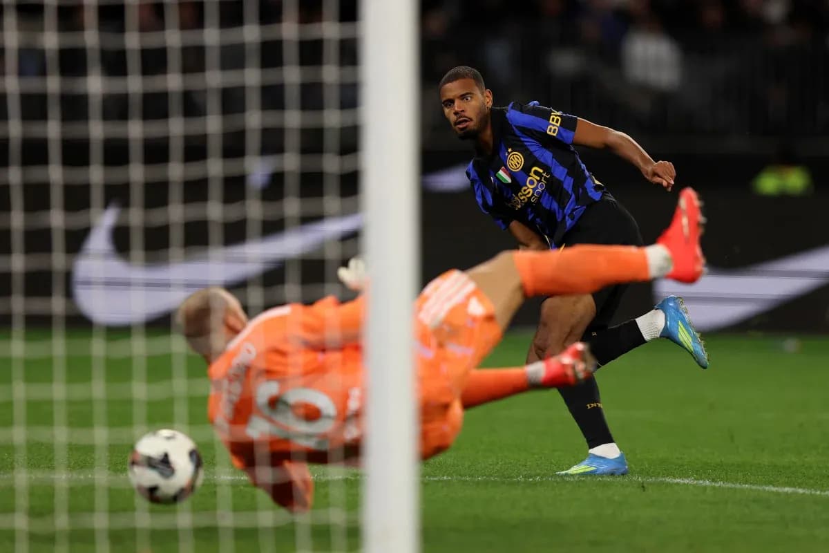 Player shooting on goal past diving goalkeeper Player shooting on goal past diving goalkeeper