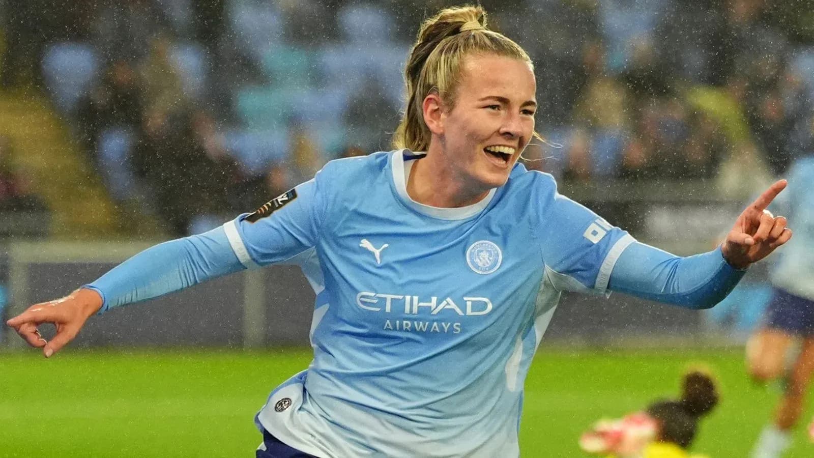 Player celebrating a goal in Manchester City kit Player celebrating a goal in Manchester City kit