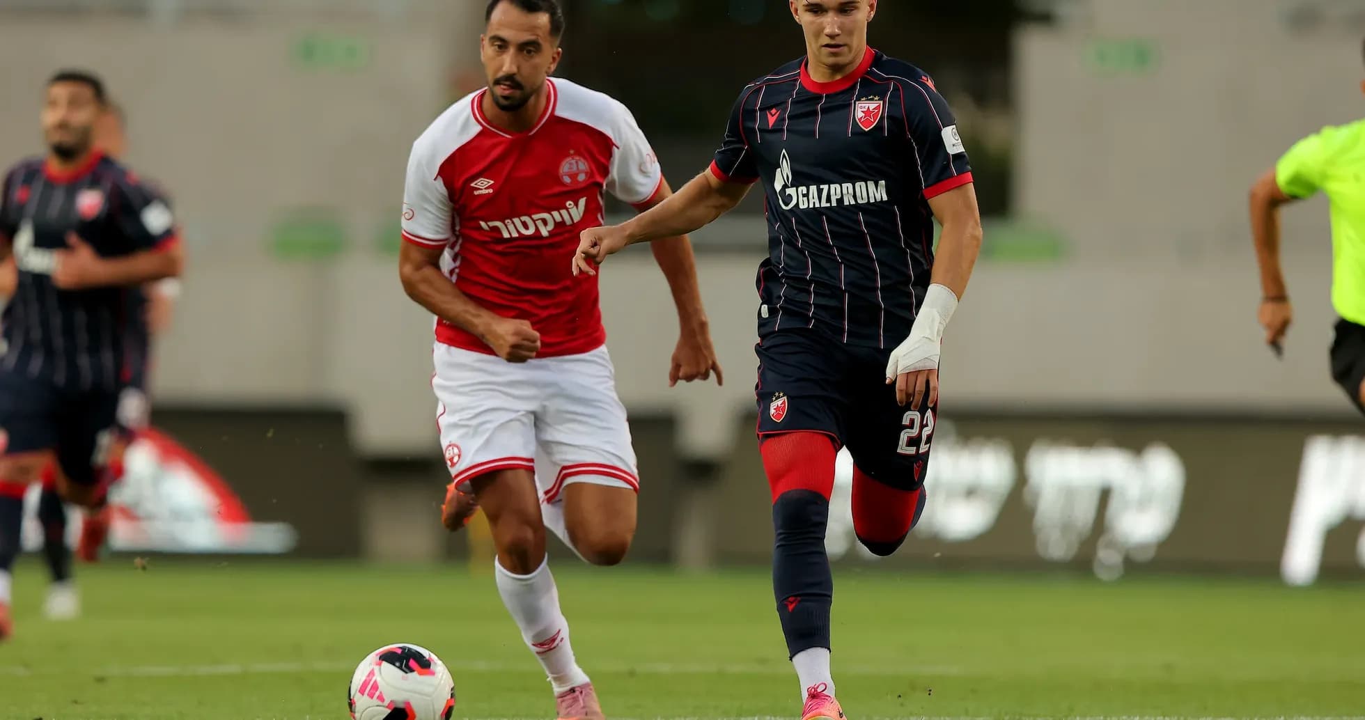 Crvena Zvezda player dribbling against Hapoel Beer Sheva Crvena Zvezda player dribbling against Hapoel Beer Sheva