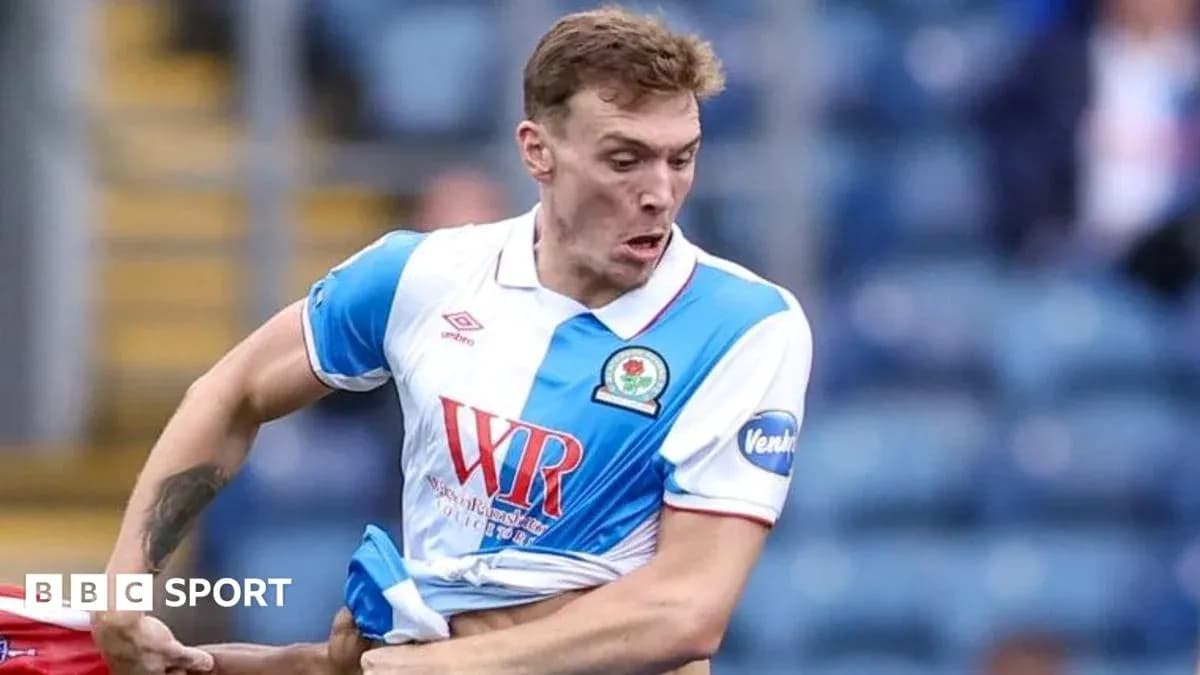 Player from Blackburn Rovers in action during match Player from Blackburn Rovers in action during match