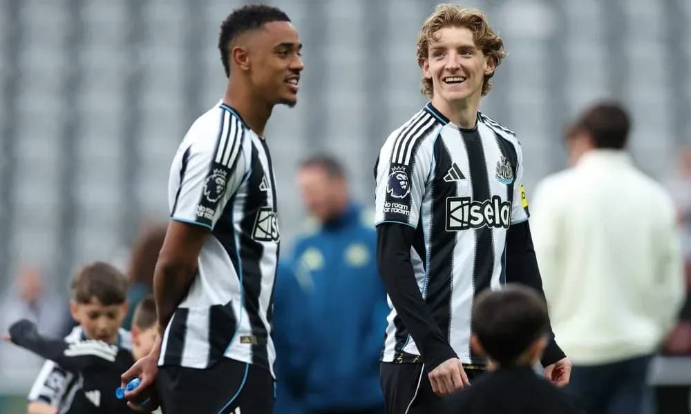 Two Newcastle players smiling during warm-up session Two Newcastle players smiling during warm-up session
