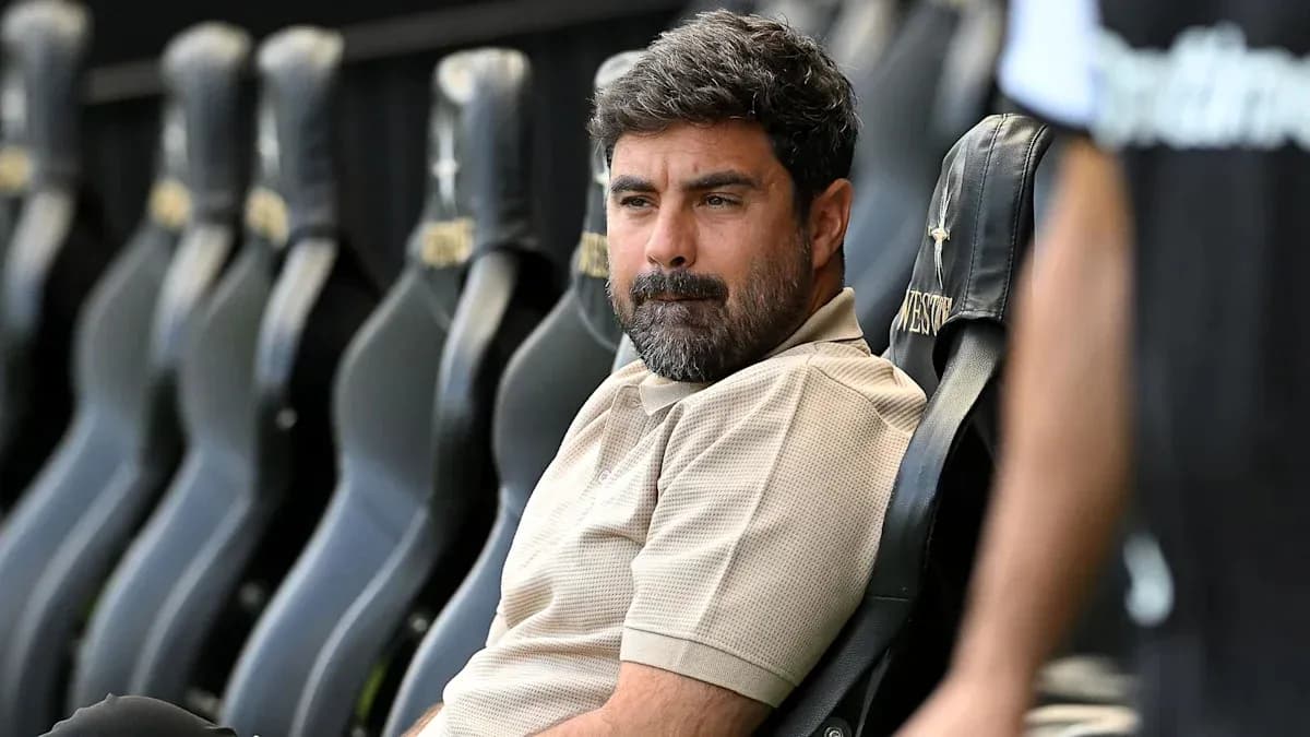 Coach seated on bench during a match Coach seated on bench during a match