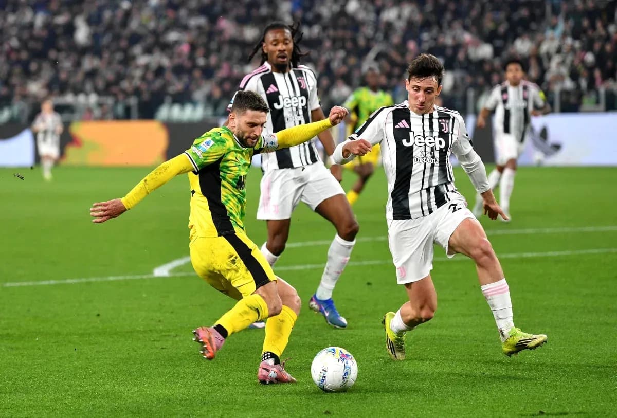 Players contesting for the ball during a match Players contesting for the ball during a match