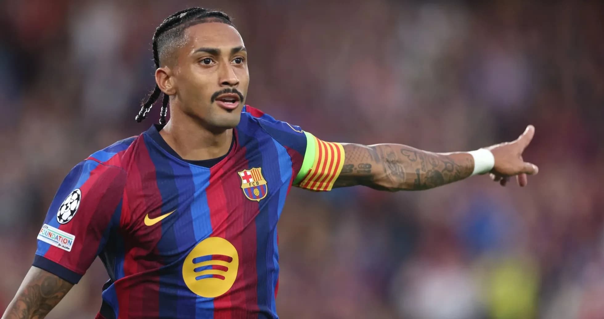 Player gesturing during a UEFA Champions League match Player gesturing during a UEFA Champions League match