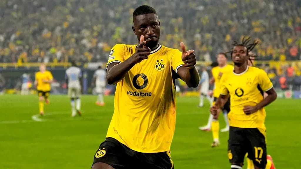 Borussia Dortmund player celebrating a goal Borussia Dortmund player celebrating a goal