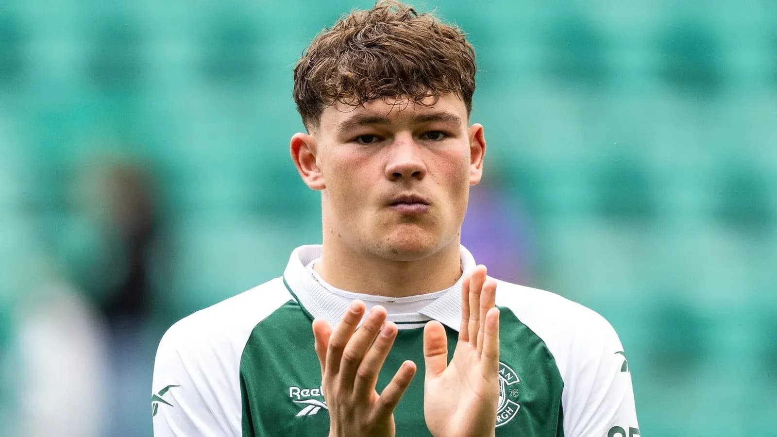 Player applauding fans in Hibernian jersey Player applauding fans in Hibernian jersey