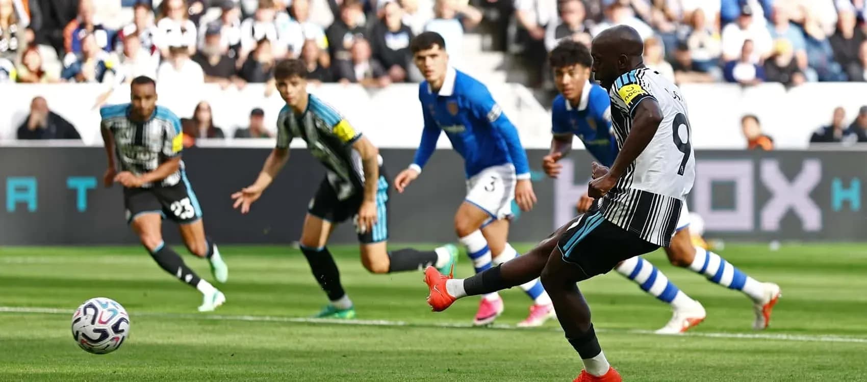Player taking a penalty kick during football match Player taking a penalty kick during football match