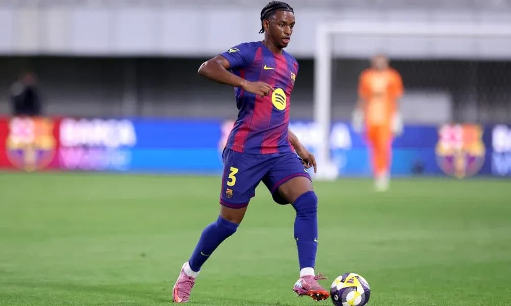 Barcelona player dribbling the ball on the pitch Barcelona player dribbling the ball on the pitch