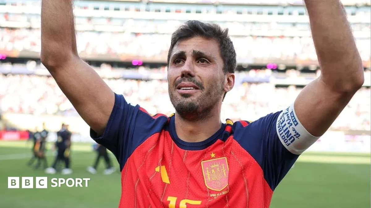 Football player celebrating with raised arms on field Football player celebrating with raised arms on field