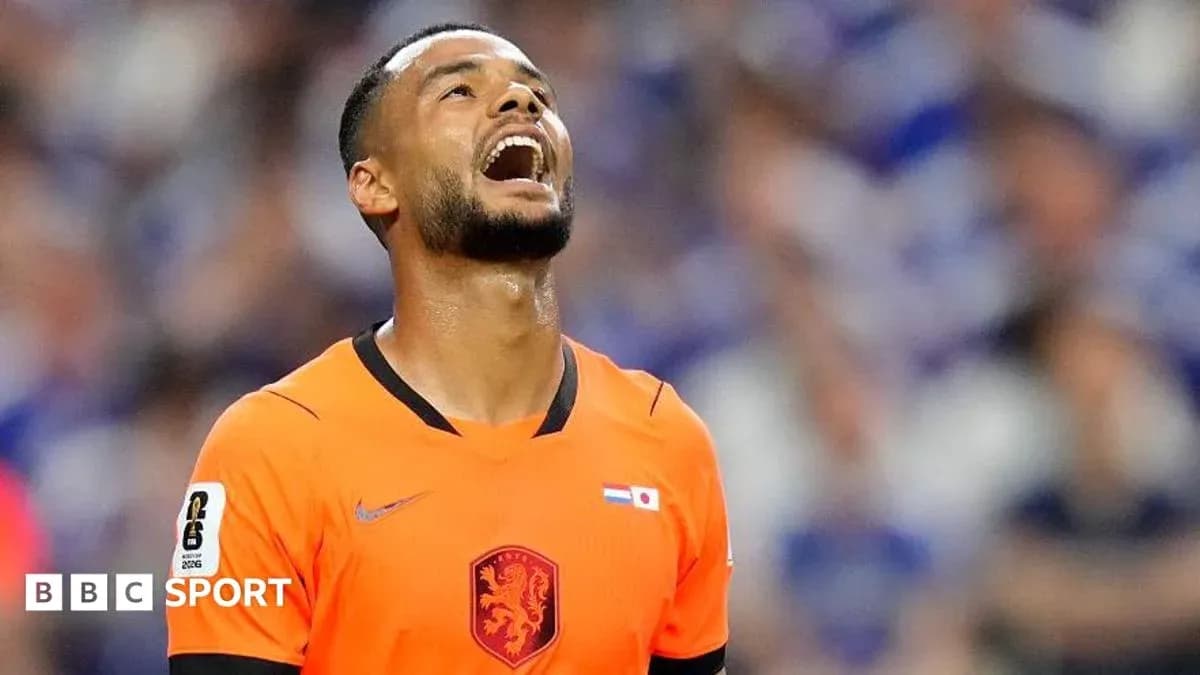 Player in orange kit looking up during match Player in orange kit looking up during match
