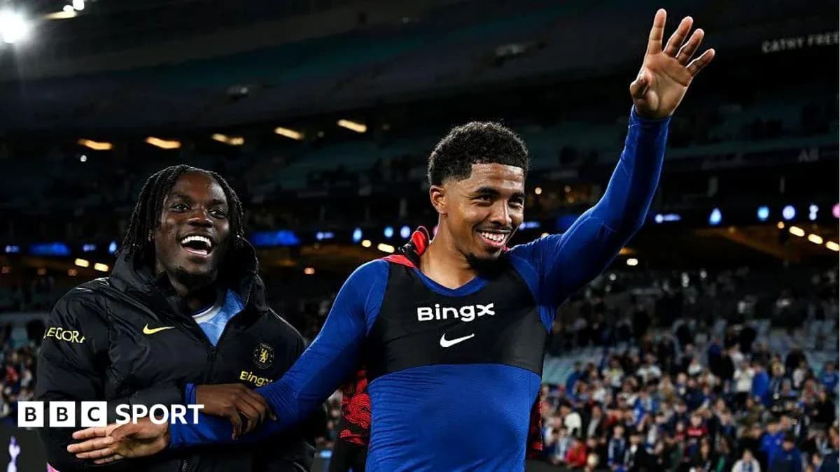 Players celebrating on the pitch after a match Players celebrating on the pitch after a match