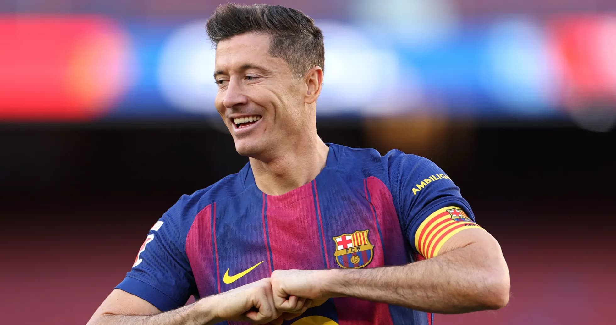 Player in Barcelona jersey celebrating on the pitch Player in Barcelona jersey celebrating on the pitch
